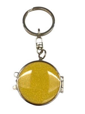 Portachiavi in acciaio di forma rotonda color giallo brillantinato con specchietto interno